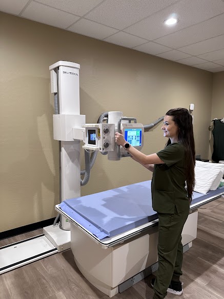 Physician with hands raised
